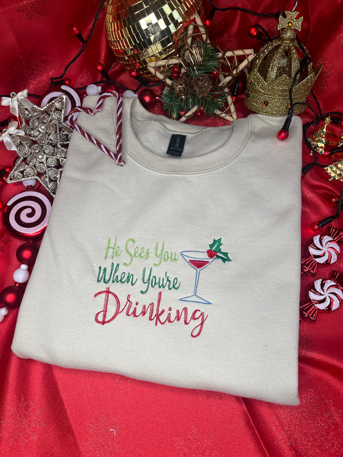 HE SEES YOU WHEN YOUR DRINKING EMBROIDERED SWEATSHIRT