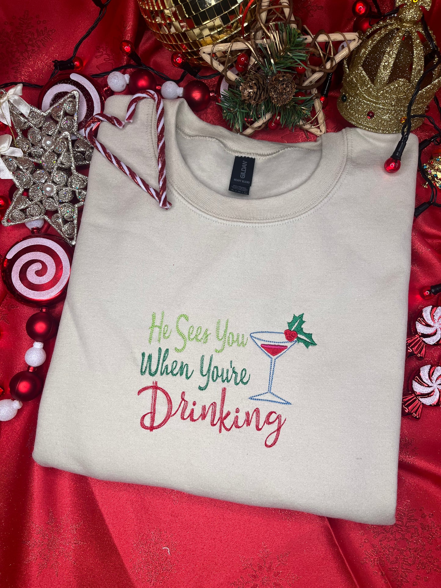 HE SEES YOU WHEN YOUR DRINKING EMBROIDERED SWEATSHIRT