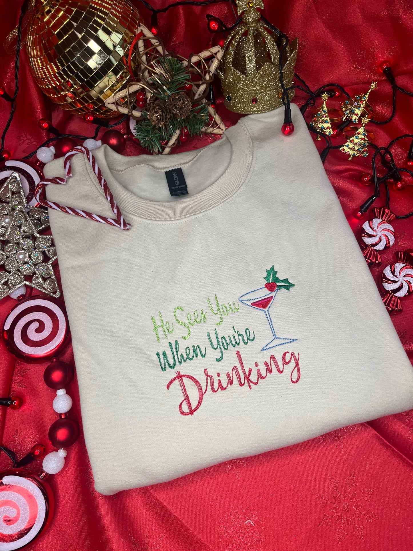 HE SEES YOU WHEN YOUR DRINKING EMBROIDERED SWEATSHIRT