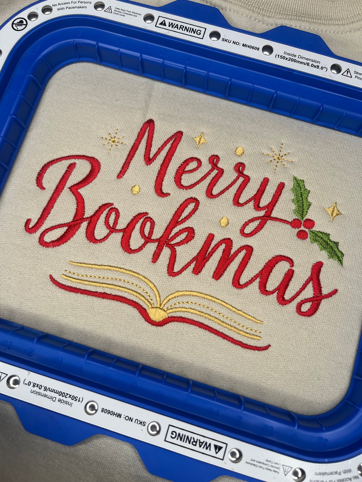 MERRY BOOKMAS EMBROIDERED SWEATSHIRT