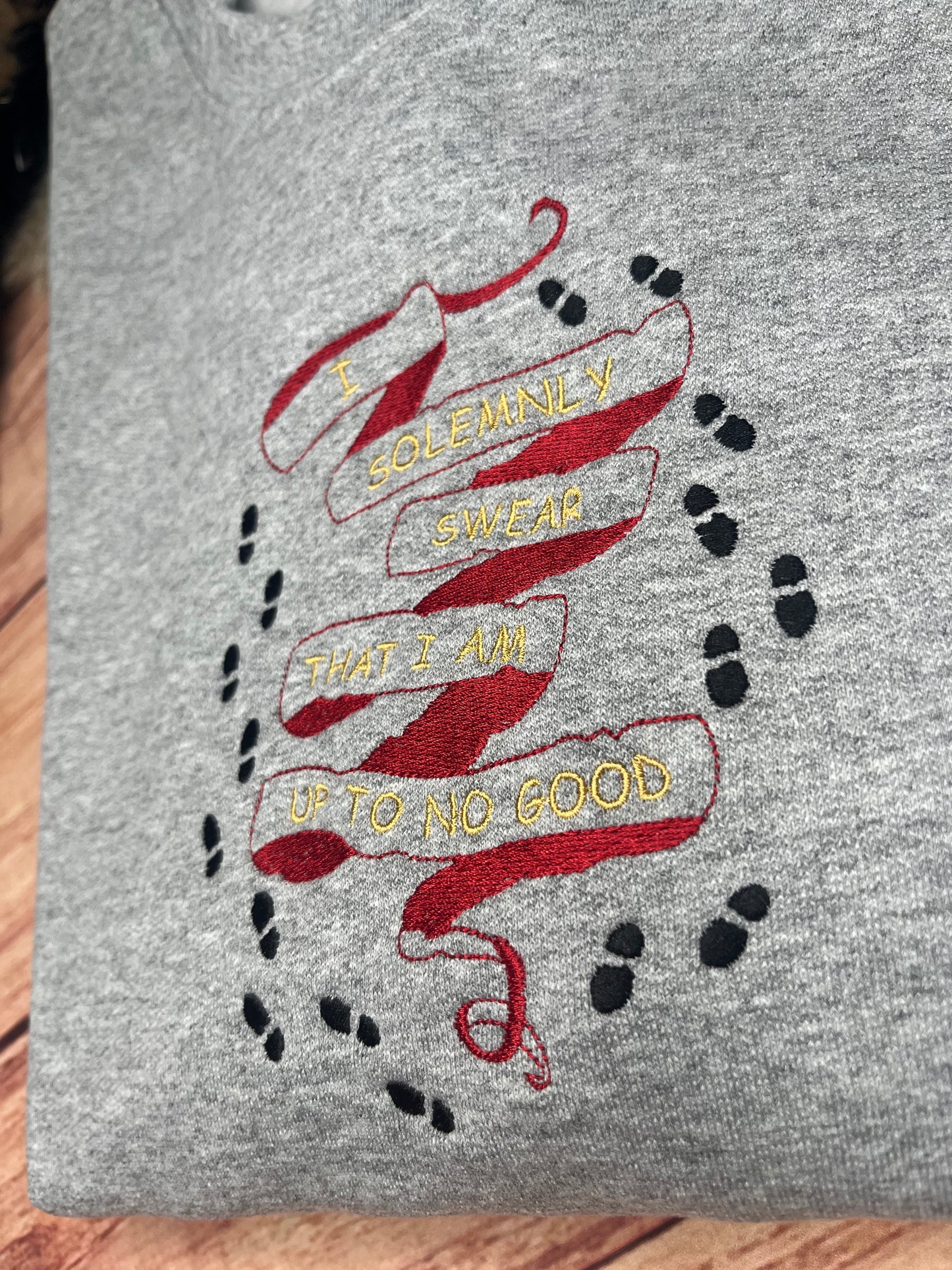 I SOLEMNLY SWEAR THAT I AM UP TO NO GOOD WITH FOOTPRINTS SWEATSHIRT