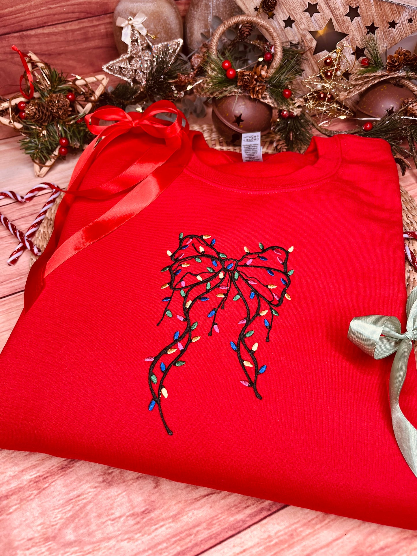 FESTIVE BOW WITH LIGHTS EMBROIDERED SWEATSHIRT