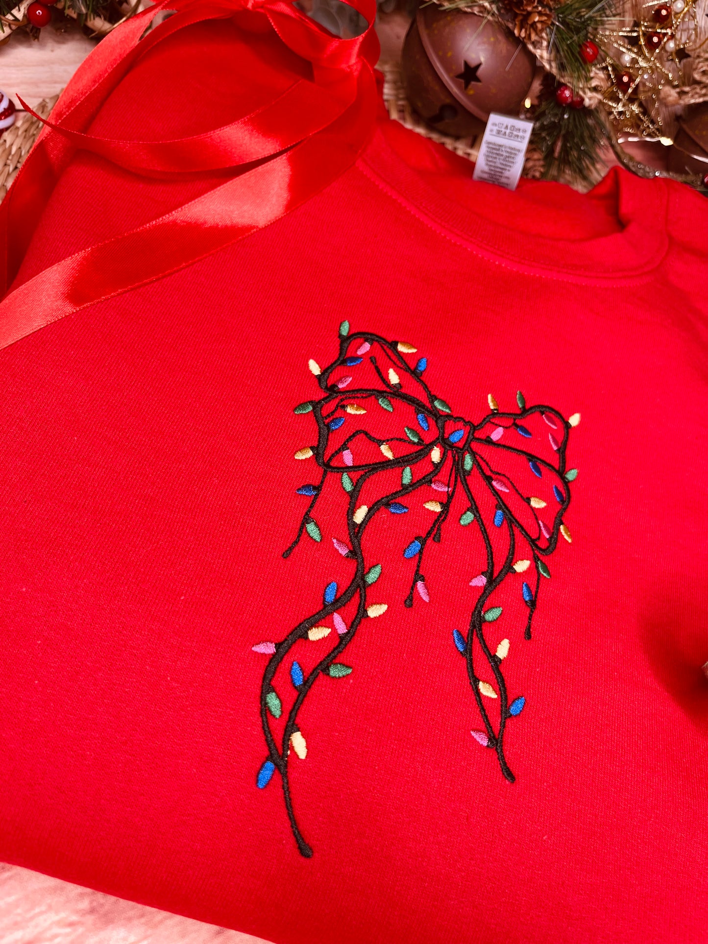 FESTIVE BOW WITH LIGHTS EMBROIDERED SWEATSHIRT