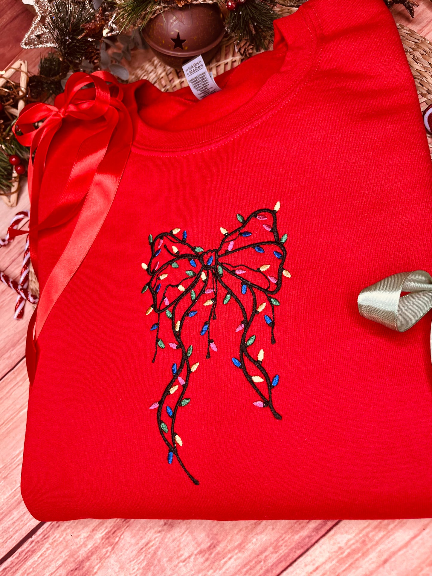 FESTIVE BOW WITH LIGHTS EMBROIDERED SWEATSHIRT