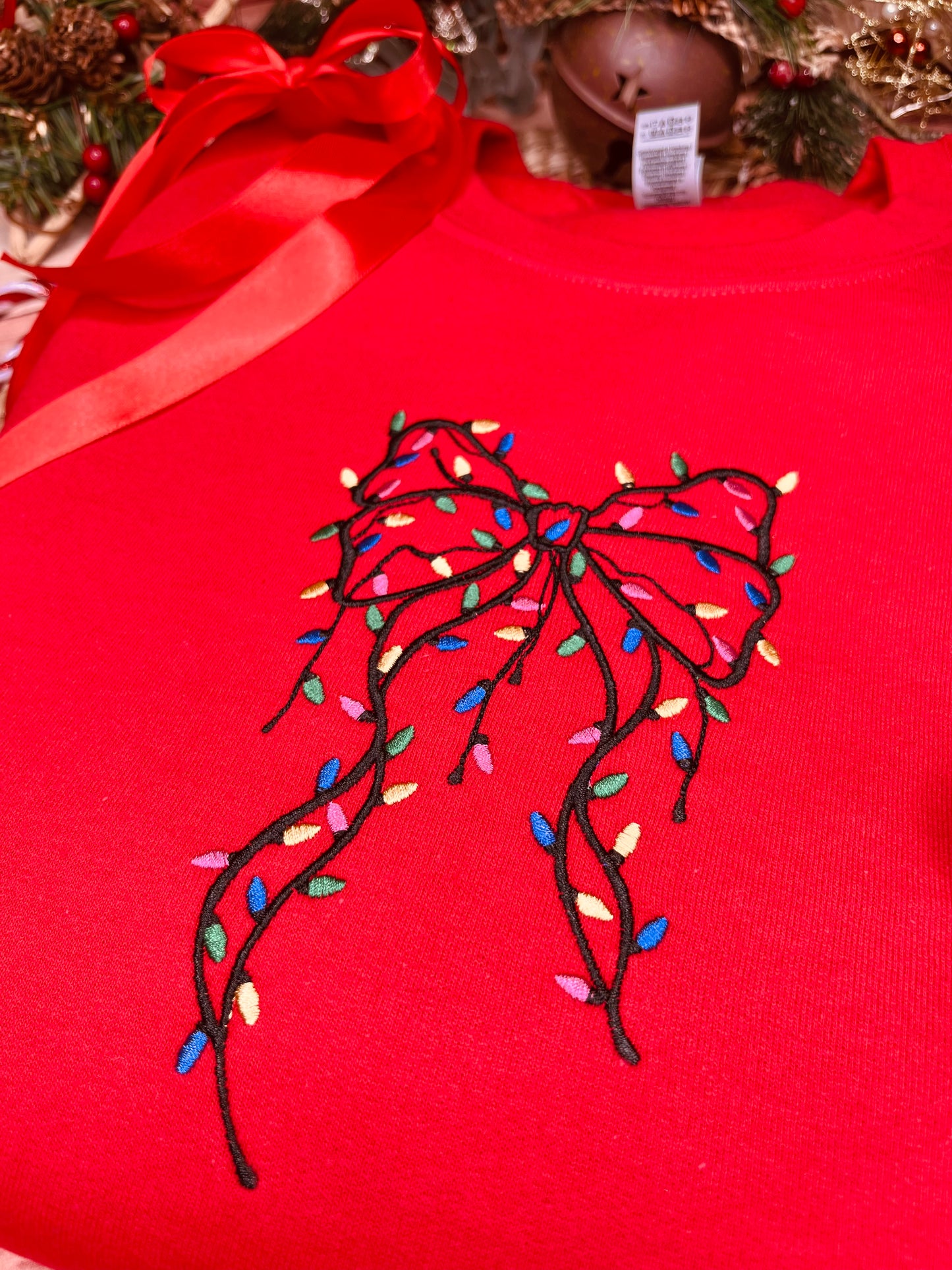 FESTIVE BOW WITH LIGHTS EMBROIDERED SWEATSHIRT